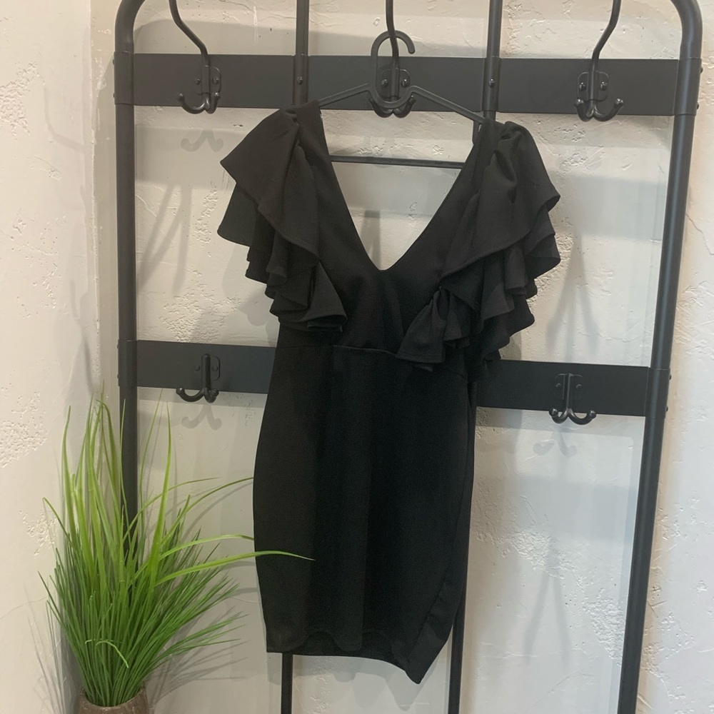 Libian, black dress, deep V, heavy ruffle